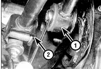 32. Отсоедините от КПП шток включения передач (1), тяги переключения передач